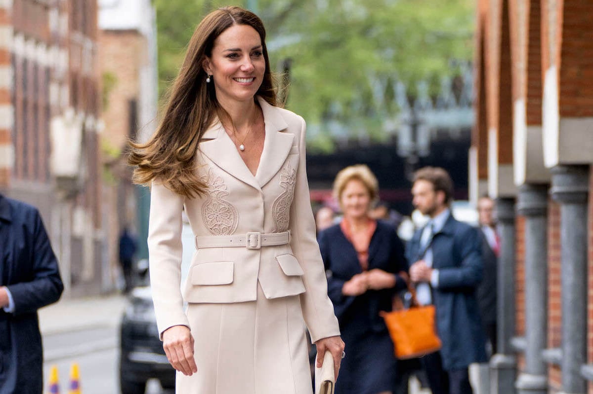 Kate Middleton smiles wearing a pineapple-embroidered outfit in 2022
