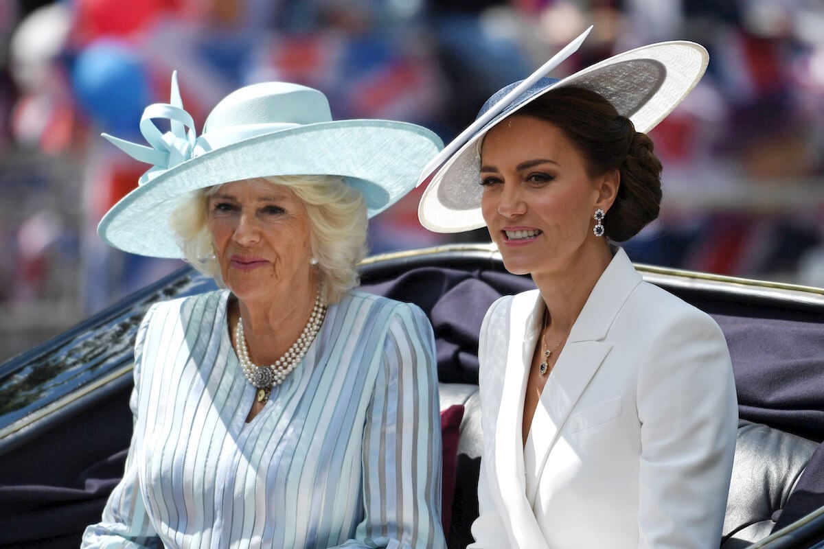 Kate Middleton, who is expected to coordinate her coronation day outfit with Camilla Parker Bowles, sits next to Camilla Parker Bowles