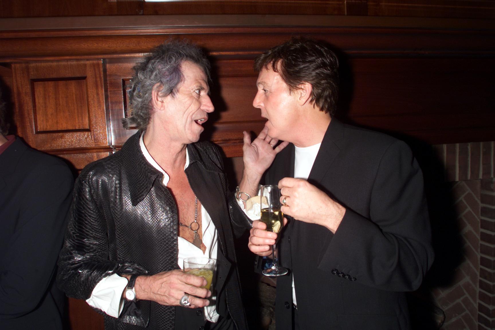 Keith Richards of The Rolling Stones and Paul McCartney of The Beatles talk during a party for the 2000 VH1 Vogue Fashion awards
