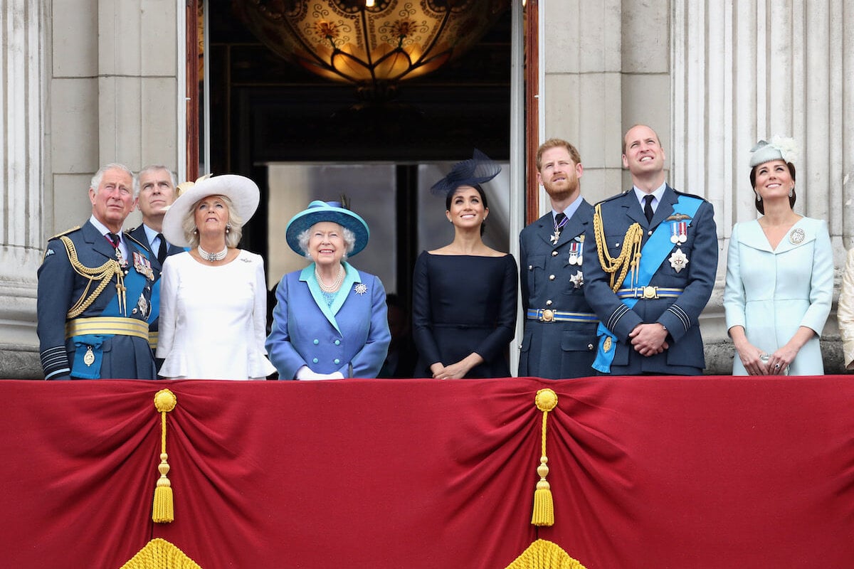 King Charles, Queen Elizabeth, Meghan Markle, Prince Harry, Prince William, and Kate Middleton, who are featured in 'New King' book revelations, stand with Prince Andrew and Camilla Parker Bowles