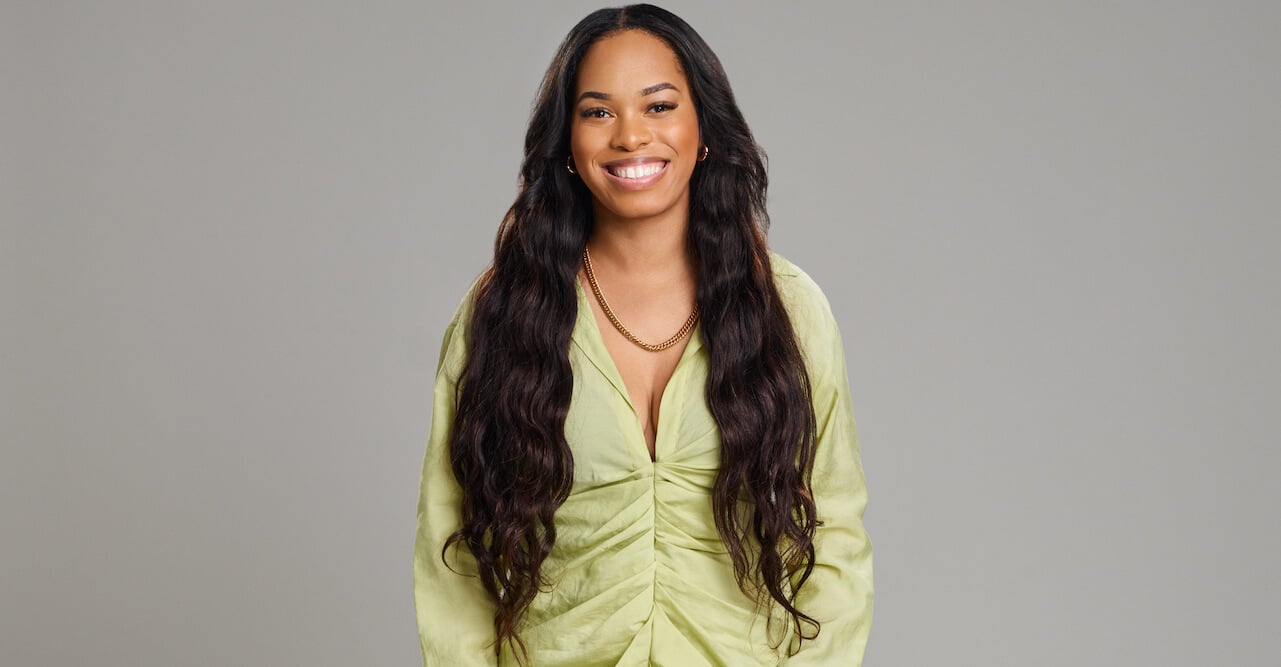 Kacia Clark smiles in a green dress for 'Love Is Blind' Season 4.