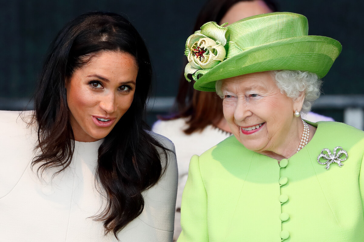 Queen Elizabeth II, who was 'surprised' by Meghan Markle's three-word reply, according to Robert Jobson's 'Our King' book, talks with Meghan Markle