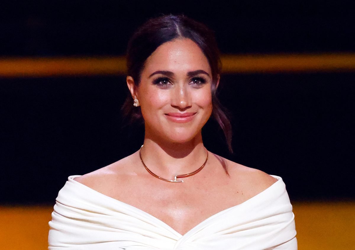 Meghan Markle, who is playing it safe by not attending the coronation, gives a speech on stage during the Opening Ceremony of the Invictus Games