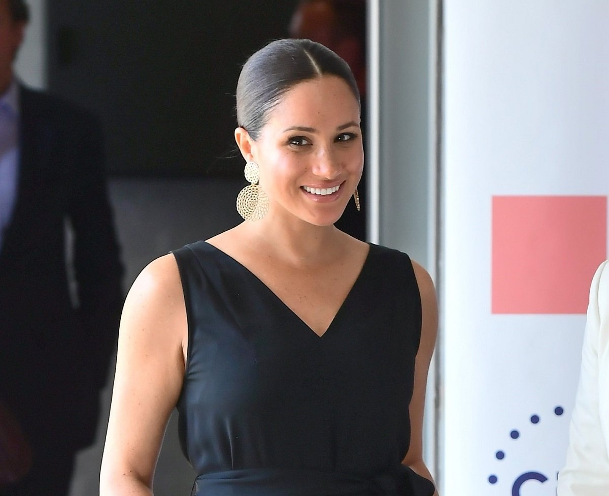 Meghan Markle, who an expert claims did not break royal fashion protocol, visits the Woodstock Exchange to meet female entrepreneurs in Cape Town, South Africa
