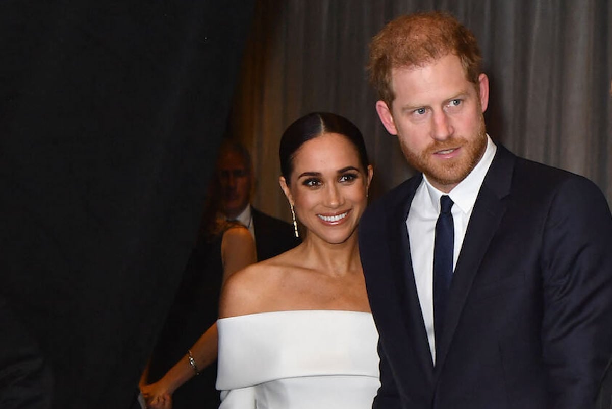 Meghan Markle, whose coronation absence is a 'huge relief' to the royal family, with Prince Harry