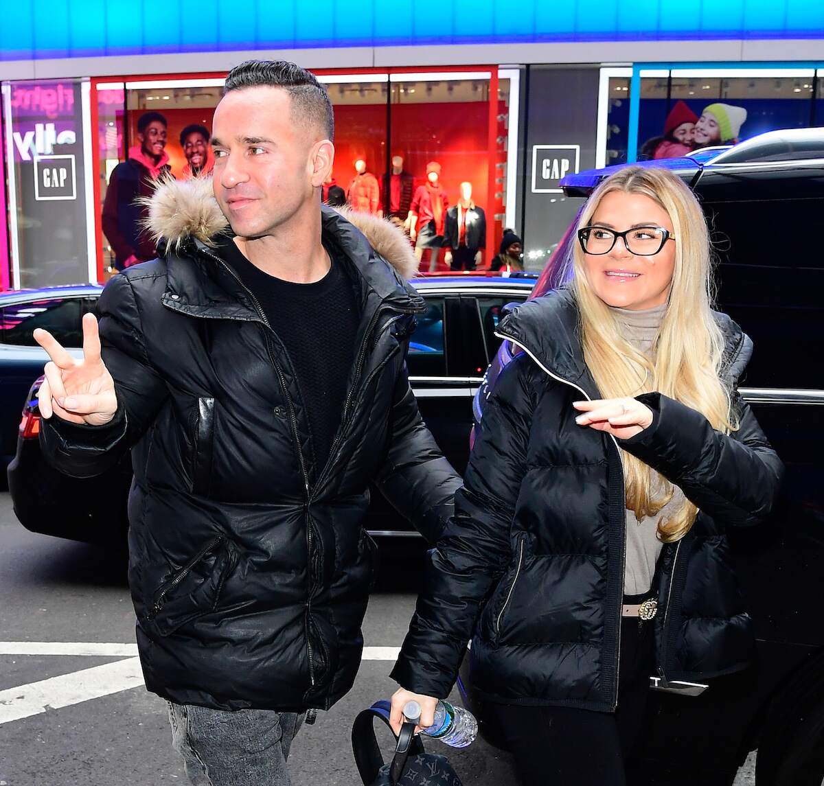 Mike 'The Situation' Sorrentino and Lauren Sorrentino waves at paparazzi in New York City