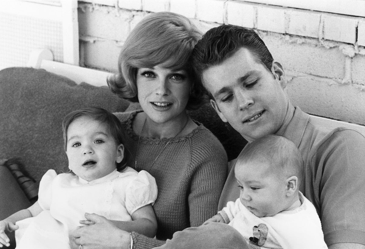 Joanna Moore holds her daughter Tatum O'Neal while second husband, Ryan O'Neal, holds their son, Griffin O'neal in an undated photo