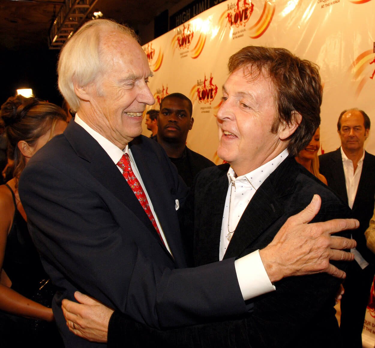 Producer George Martin (left) embraces Paul McCartney at a 2006 event in Las Vegas.