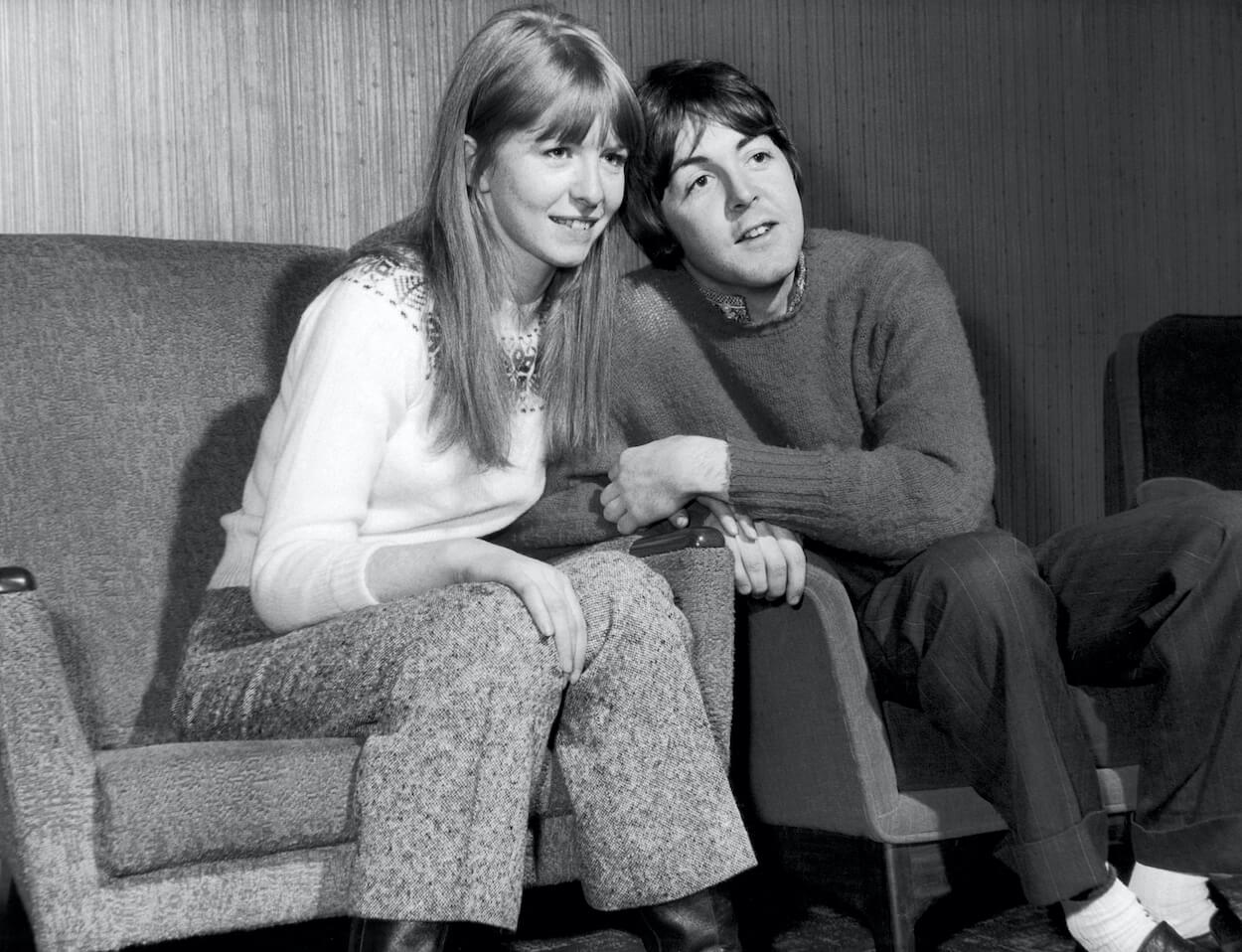 Jane Asher (left) and Paul McCartney sit in chairs at a hotel in Scotland in December 1967.