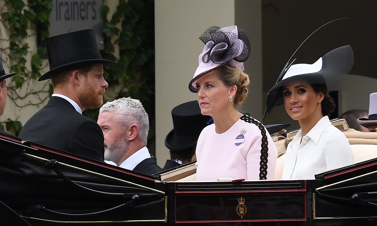 Prince Harry, Meghan Markle, and Sophie the Duchess of Edinburgh, who let her "authentic feelings" about the Sussexes be known, arrive in an open carriage to attend the first day of Royal Ascot