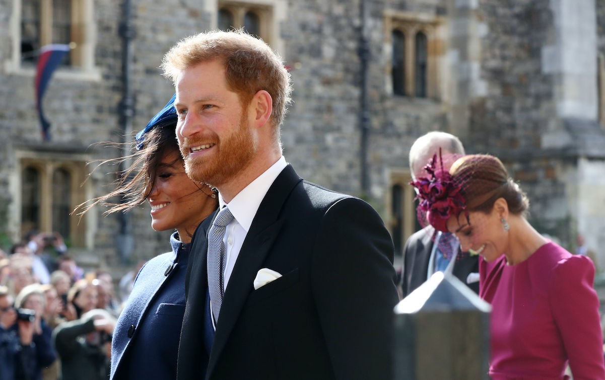 Prince Harry Meghan Markle walking with wind in hair