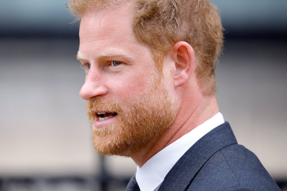 Prince Harry, who said in 'Spare' he was a 'nonperson' before marriage, looks on