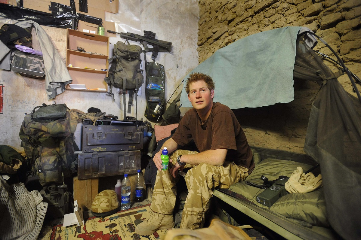 Prince Harry sitting on his bed at a camp in Southern Afghanistan