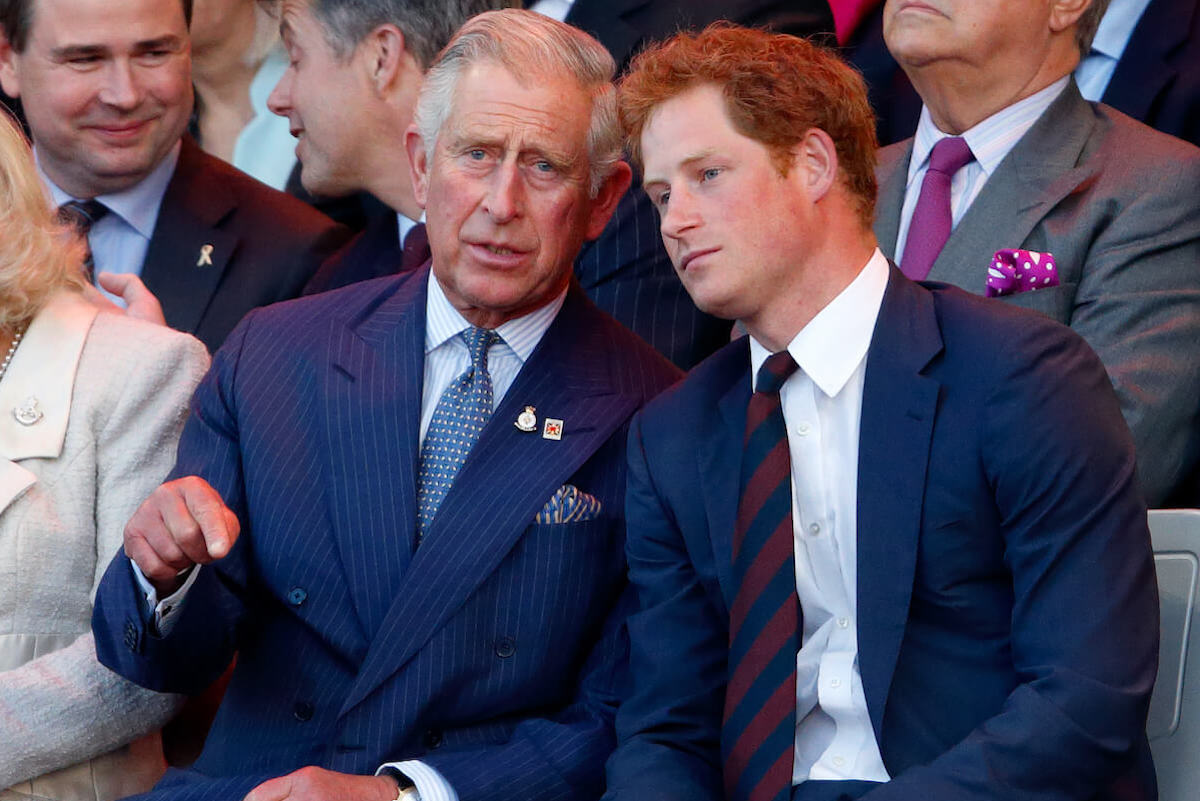 Prince Harry, who shared heartbreaking 'Spare' passages about King Charles as a father, looks on with King Charles