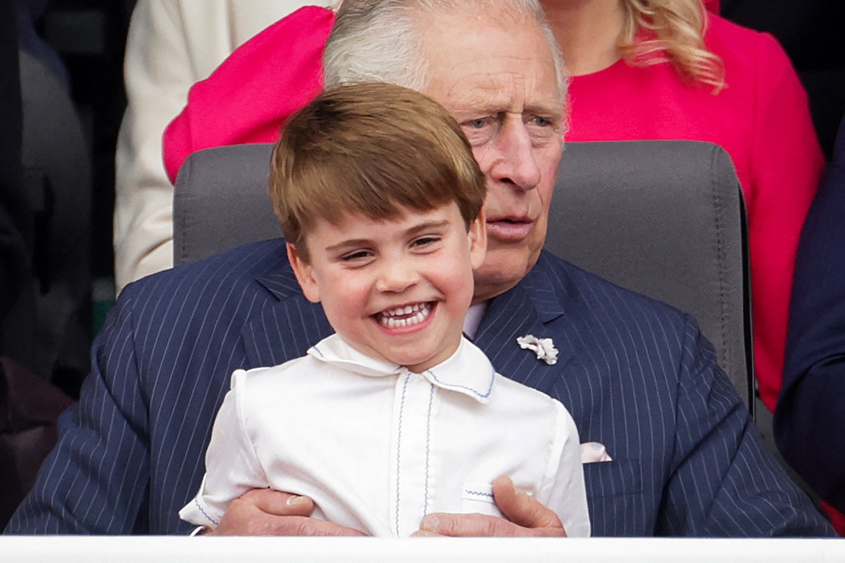 Prince Louis laughing while on King Charles' knee during Platinum Pageant
