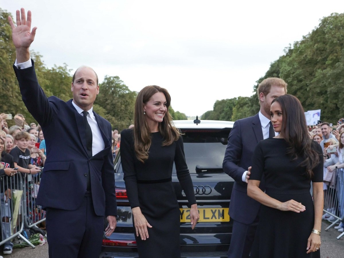 Prince William, Kate Middleton, Prince Harry, and Meghan Markle wave to crowd on the long Walk at Windsor Castle