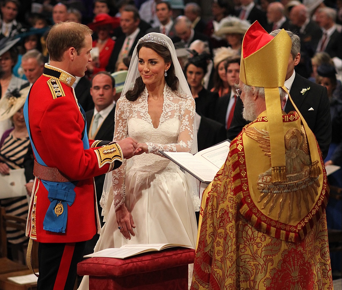 Prince William and Kate Middleton exchange rings in front of the Archbishop of Canterbury Rowan Williams during wedding
