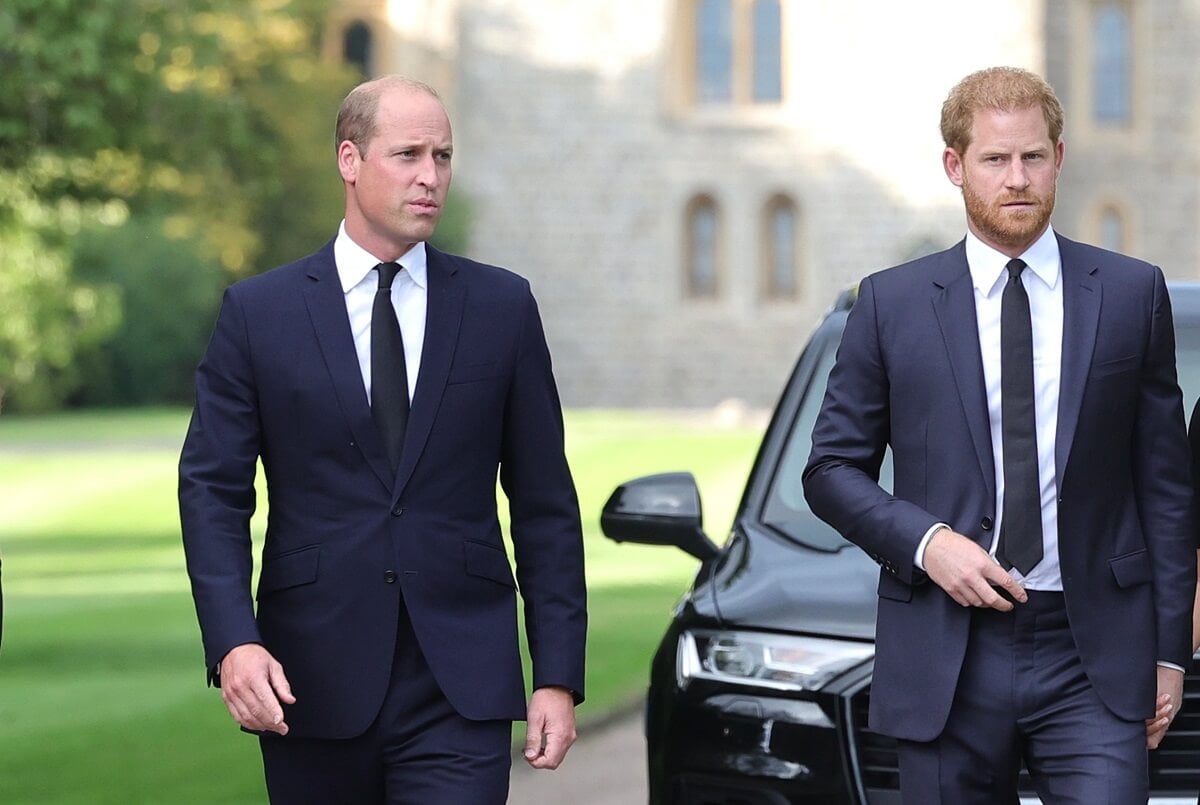 Prince William and Prince Harry, who will be separated at King Charles' coronation, arriving on the long Walk at Windsor Castle to view tributes for Queen Elizabeth