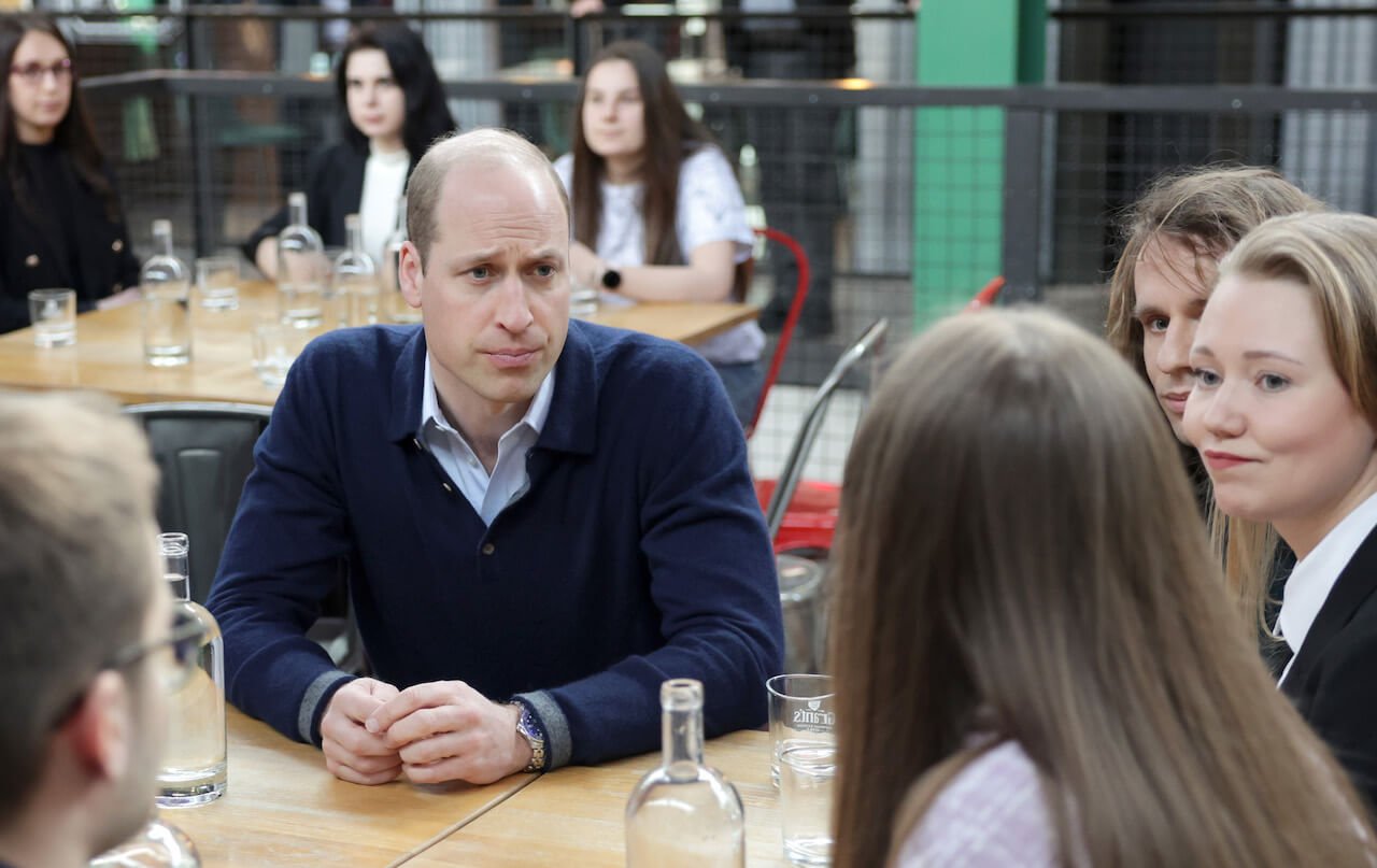 Prince William, Prince of Wales listens to young Ukrainian refugees and hears about their experiences of settling into life in Poland at Hala Koszyki Food Hall during day two of his visit on March 23, 2023, in Warsaw, Poland.