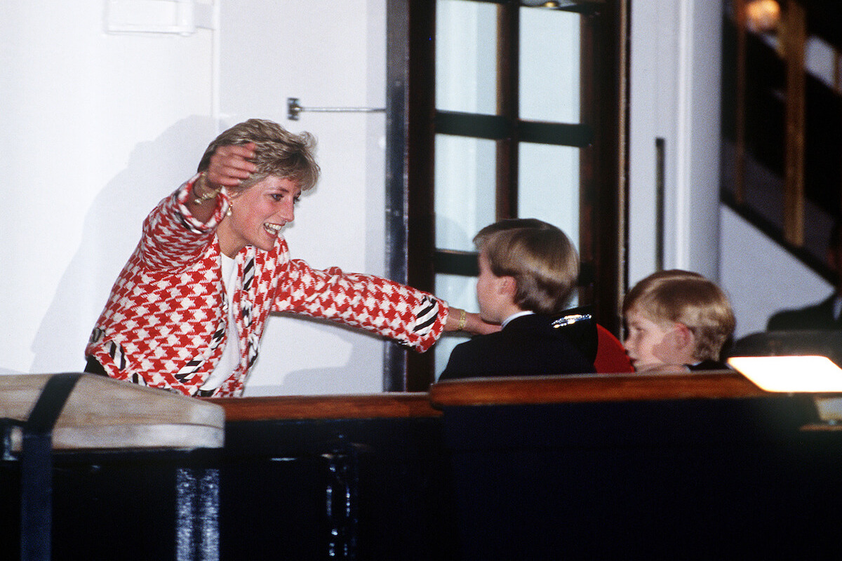 Princess Diana, whose body language with children hinted at 'breath of change' in the royal family, hugs Prince William and Prince Harry 