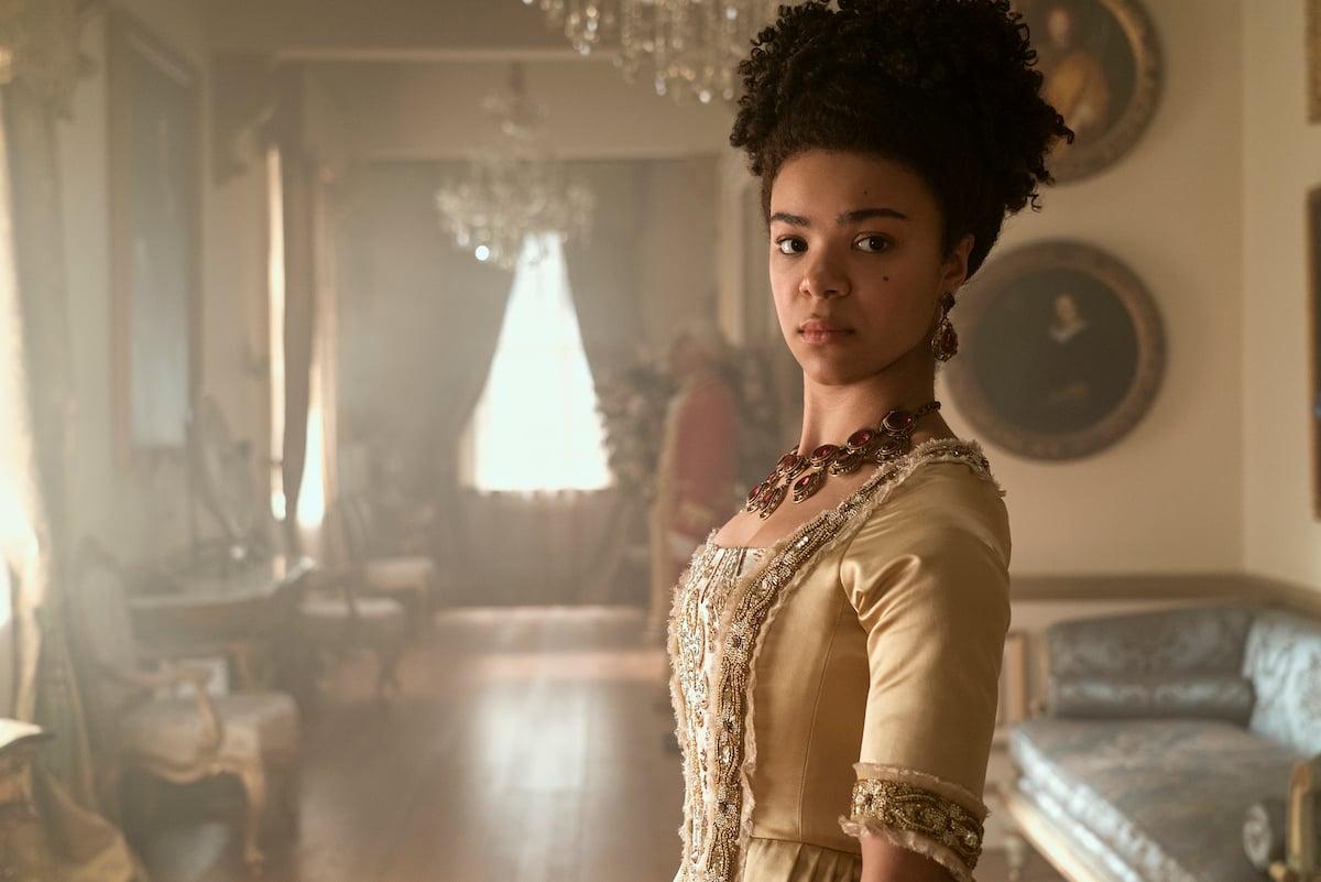 India Amarteifio as Young Queen Charlotte in 'Queen Charlotte: A Bridgerton Story' looking to the side