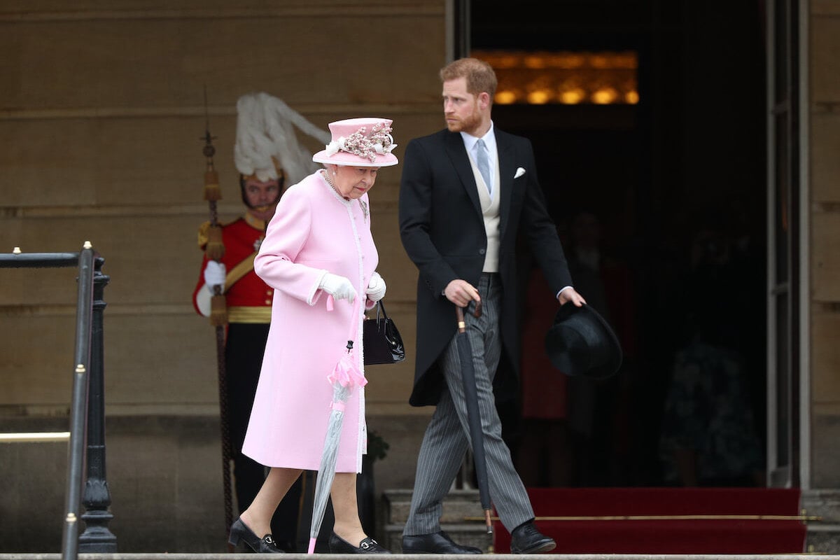 Queen Elizabeth II and Prince Harry, who called King Charles on advice from the queen, according to Robert Jobson's 'Our King'