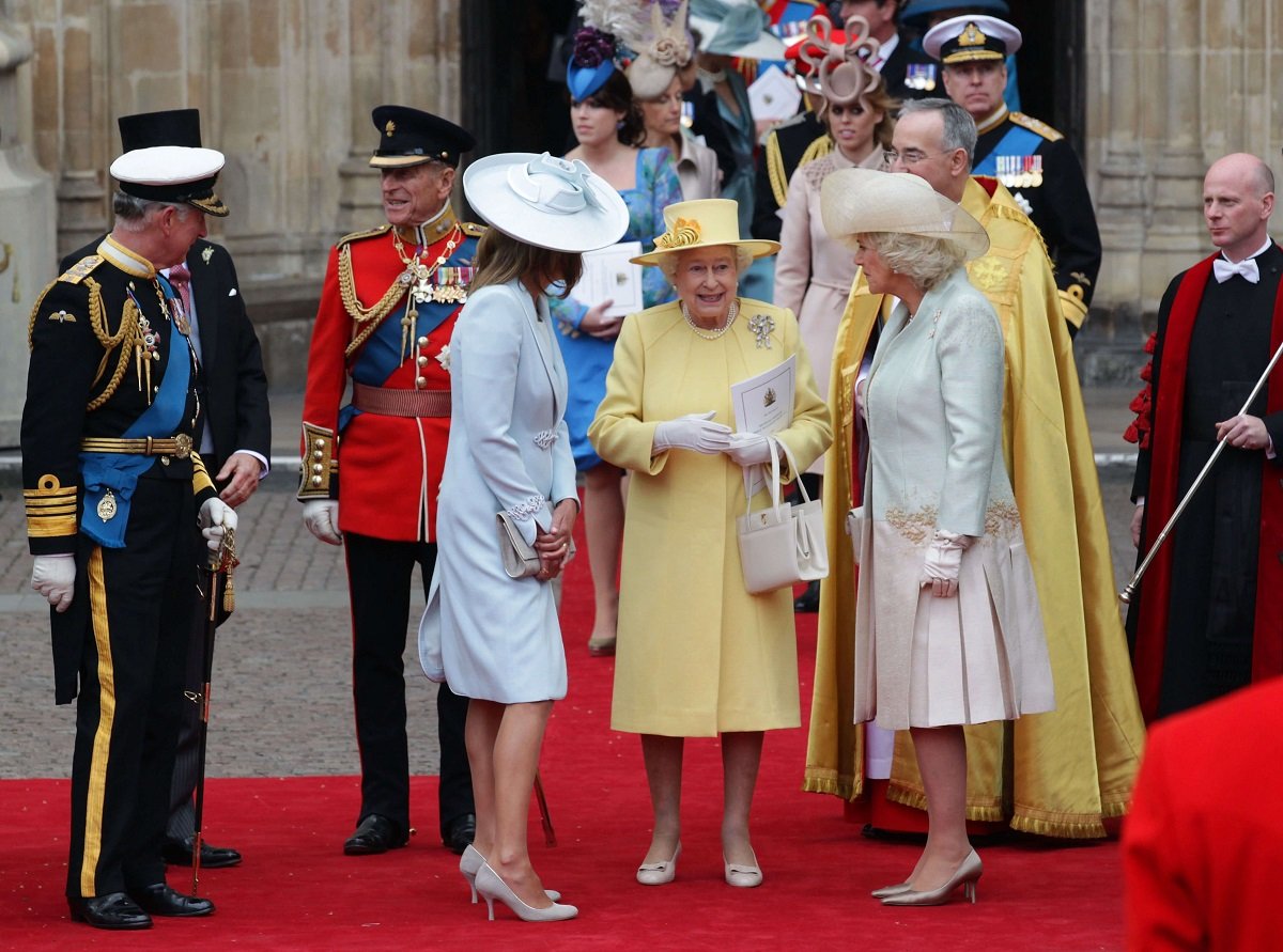 Queen Elizabeth II and other members of the family standing outside Westminster Abbey after Prince William and Kate Middleton's wedding