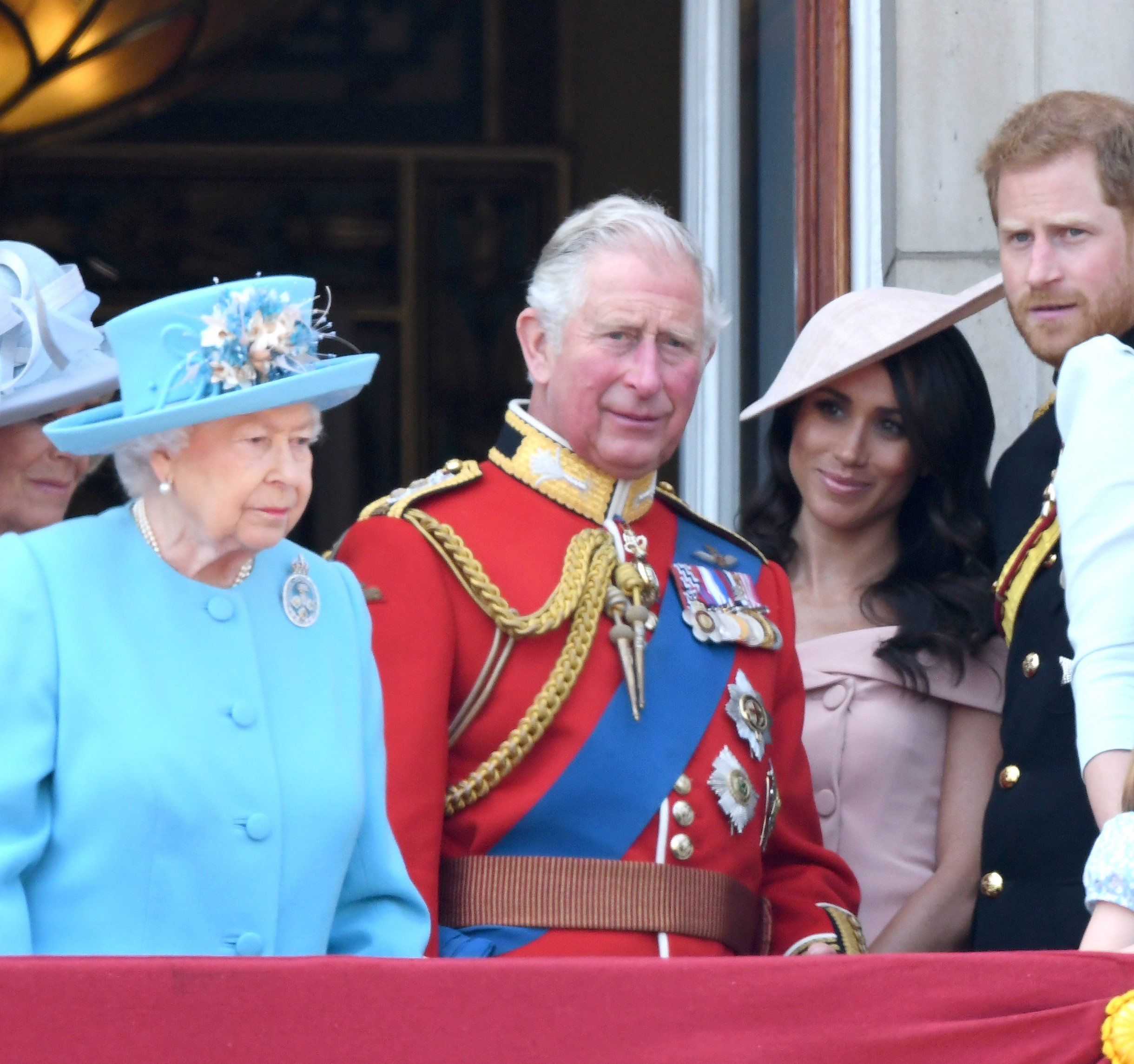 Queen Elizabeth II, then-Prince Charles, Meghan Markle, and Prince Harry on the balcony of Buckingham Palace during Trooping The Colour 2018