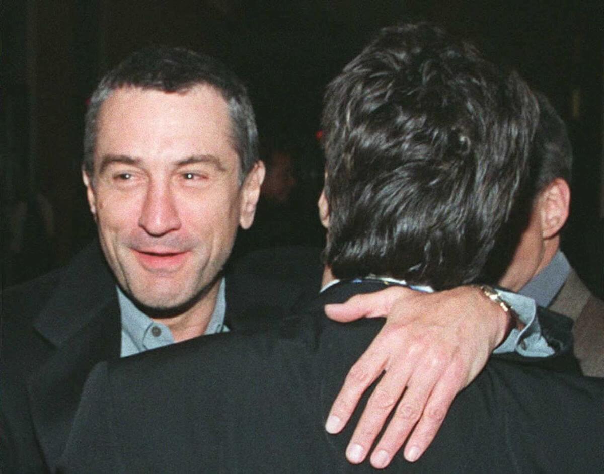 Robert DeNiro hugs Al Pacino