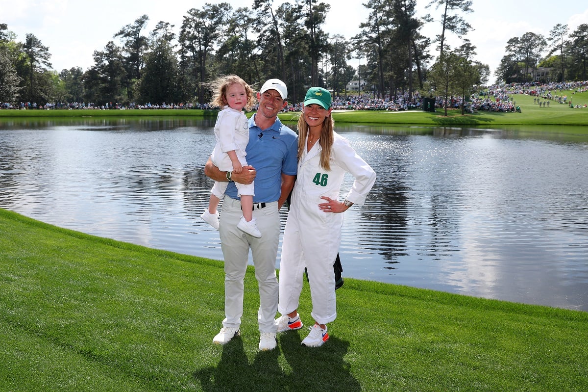 Rory McIlroy poses for a photo with wife, Erica Stoll and daughter Poppy McIlroy prior to the 2023 Masters Tournament