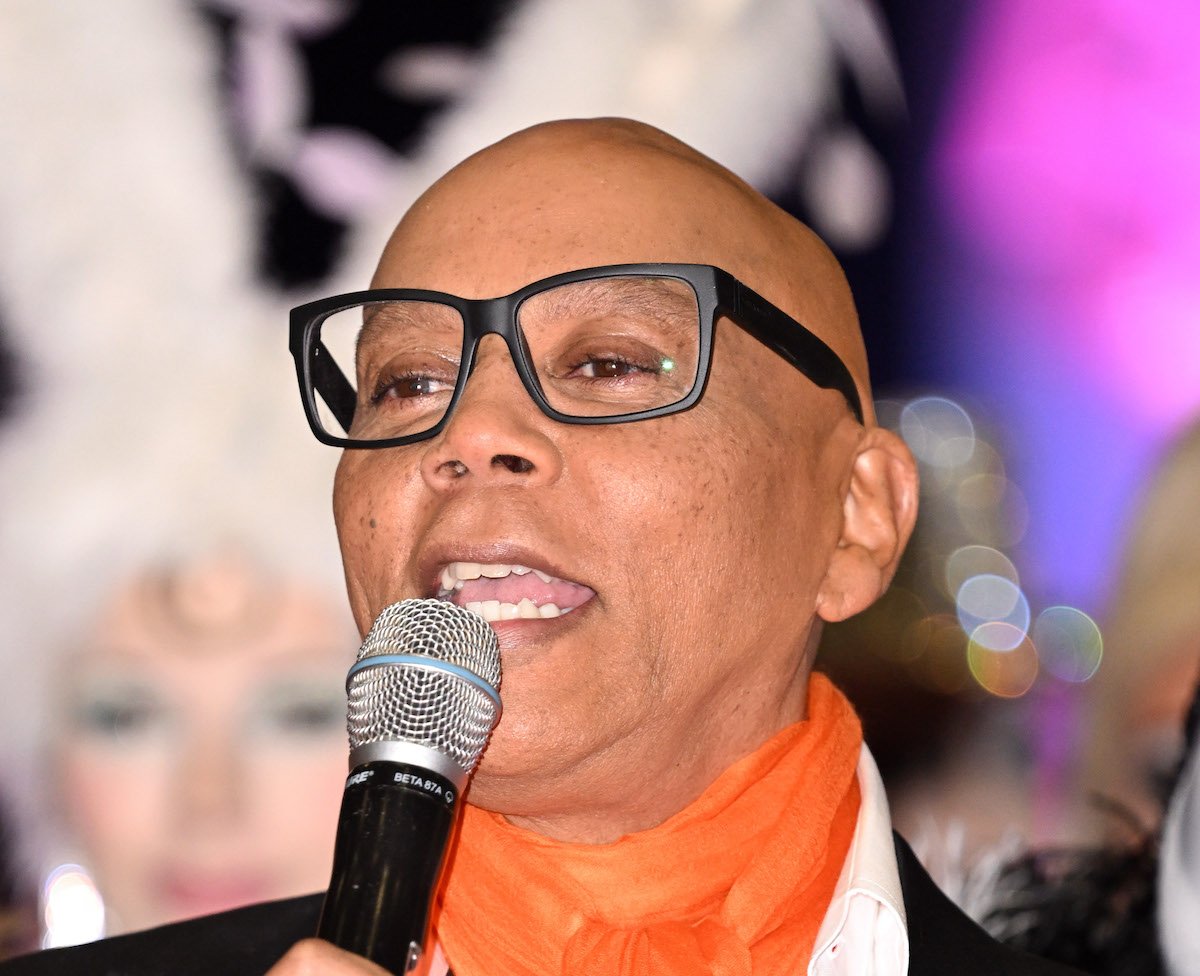 RuPaul speaking into a microphone