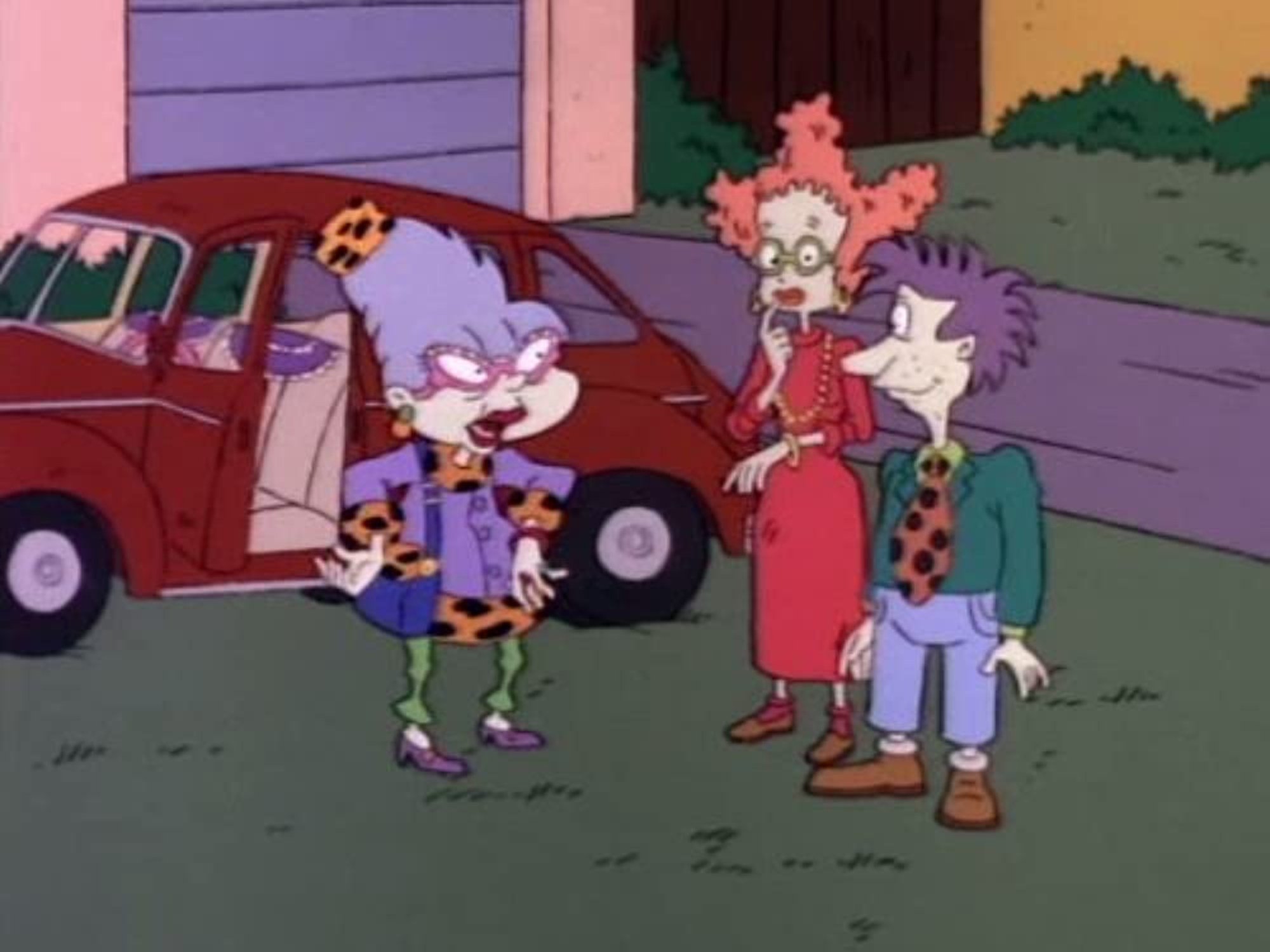 'Rugrats' episodes Aunt Miriam, Didi Pickles, and Stu Pickles standing outside of Miriam's car on the grass in front of the house.