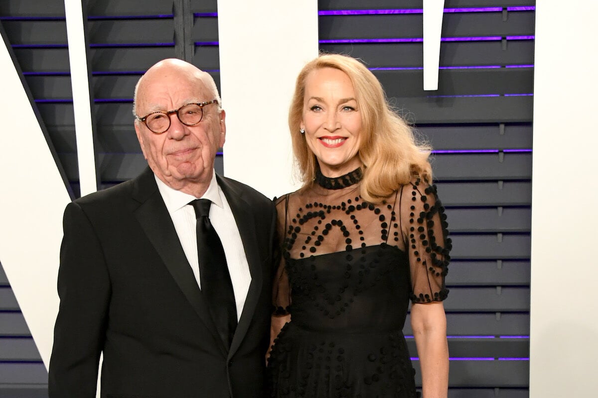Rupert Murdoch and Jerry Hall standing together dressed up