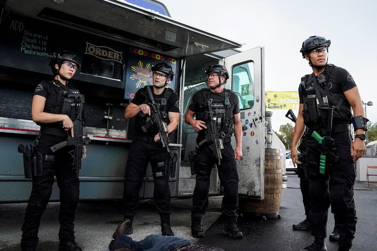 Adela Paez as Leticia, Alex Russell as Jim Street, Kenneth Kenny Johnson as Dominique Luca, and David Lim as Victor Tan standing next to a food truck during a scene in 'S.W.A.T.'
