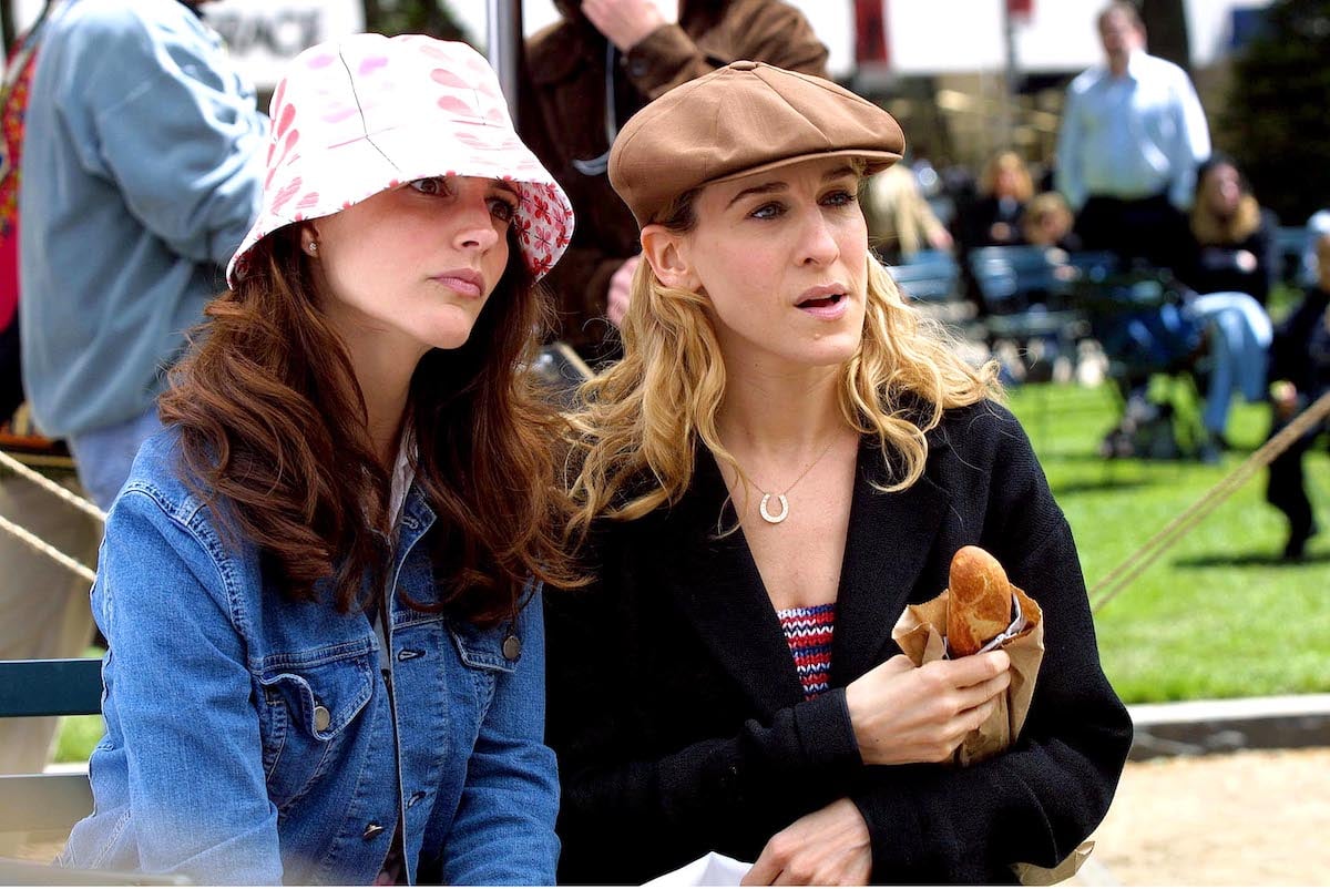 Kristin Davis as Charlotte York and Sarah Jessica Parker as Sarah Jessica Parker sitting in Central Park in 'Sex and the City'