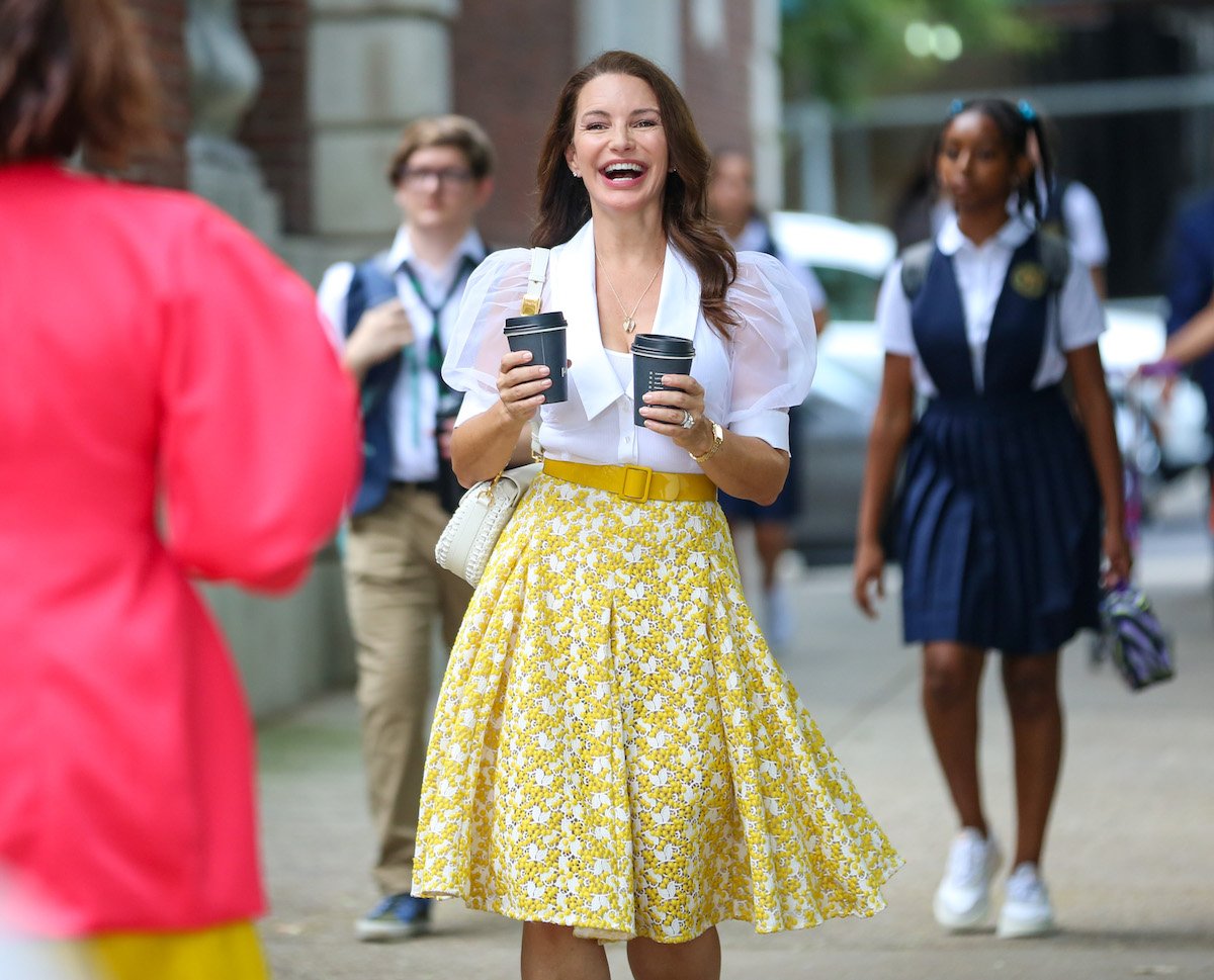 Kristin Davis as Charlotte York waking with coffees in her hand in "And Just Like That..."