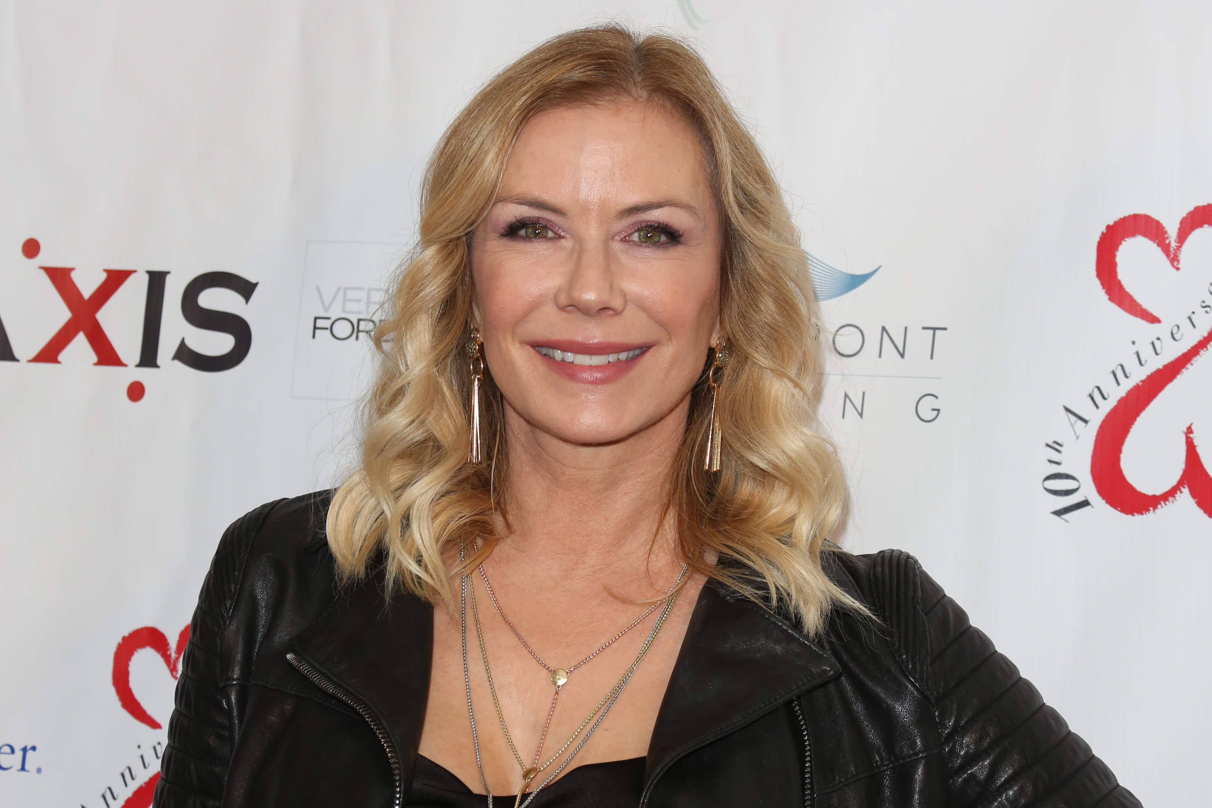 'The Bold and the Beautiful' star Katherine Kelly Lang dressed in a black outfit, smiling for a red carpet photo.