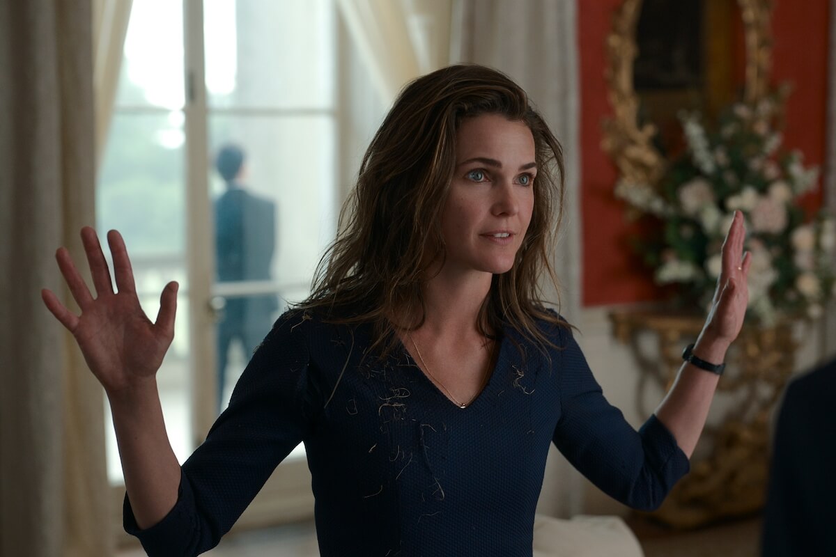 Keri Russell in 'The Diplomat' on Netflix with her arms raised