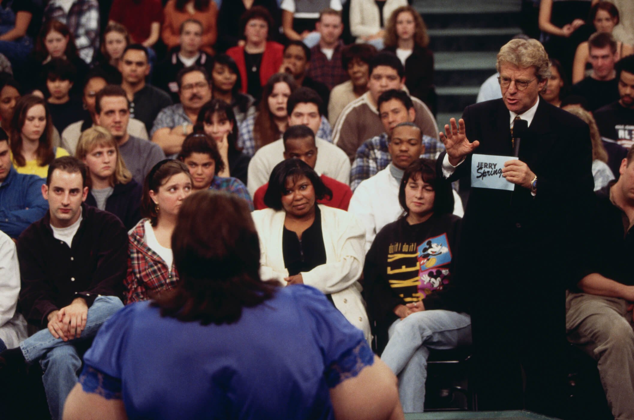 Jerry Springer standing in the audience and talking on 'The Jerry Springer Show'
