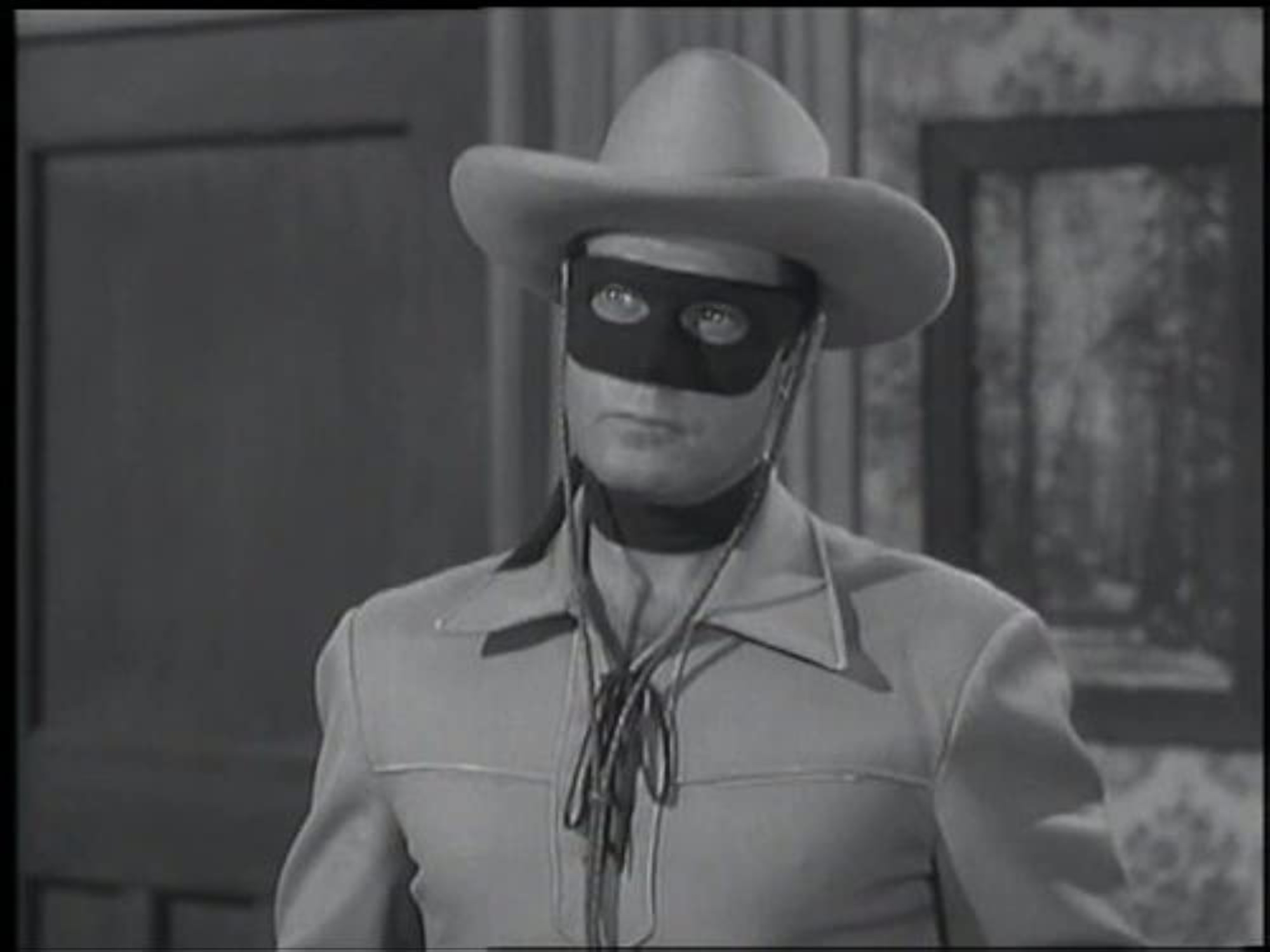'The Lone Ranger' Clayton Moore as the Lone Ranger in season 4 episodes. He's wearing a black mask, cowboy hat, and Western costume.