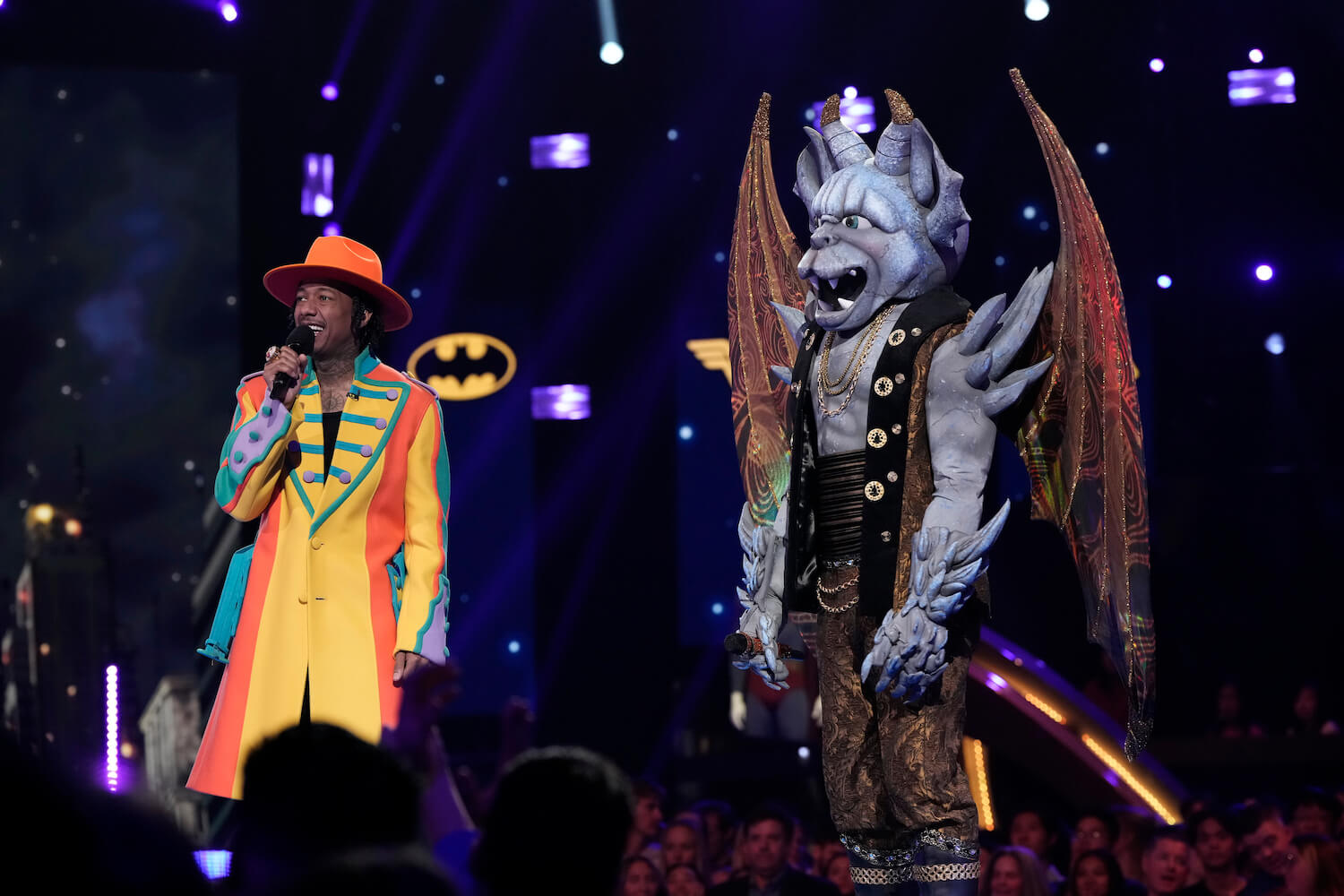 Gargoyle standing with Nick Cannon on 'The Masked Singer' Season 9