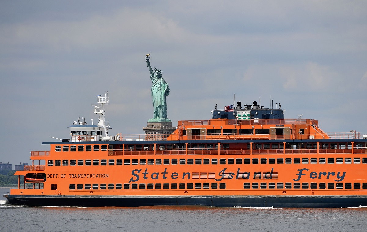 The Staten Island Ferry is seen in front of the Statue of Liberty in 2020