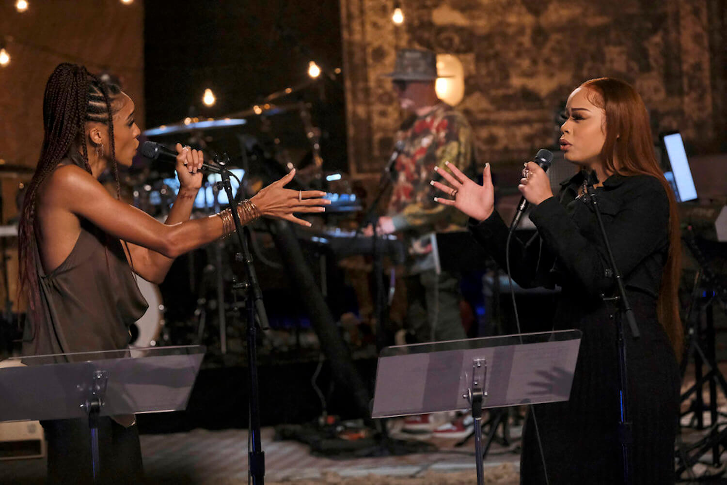 Chloe Abbott vs. NariYella singing against each other on stage in 'The Voice' Season 23 battles
