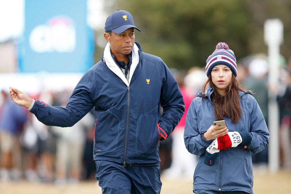 Tiger Woods and Erica Herman look on during the Presidents Cup at Royal Melbourne Golf Course