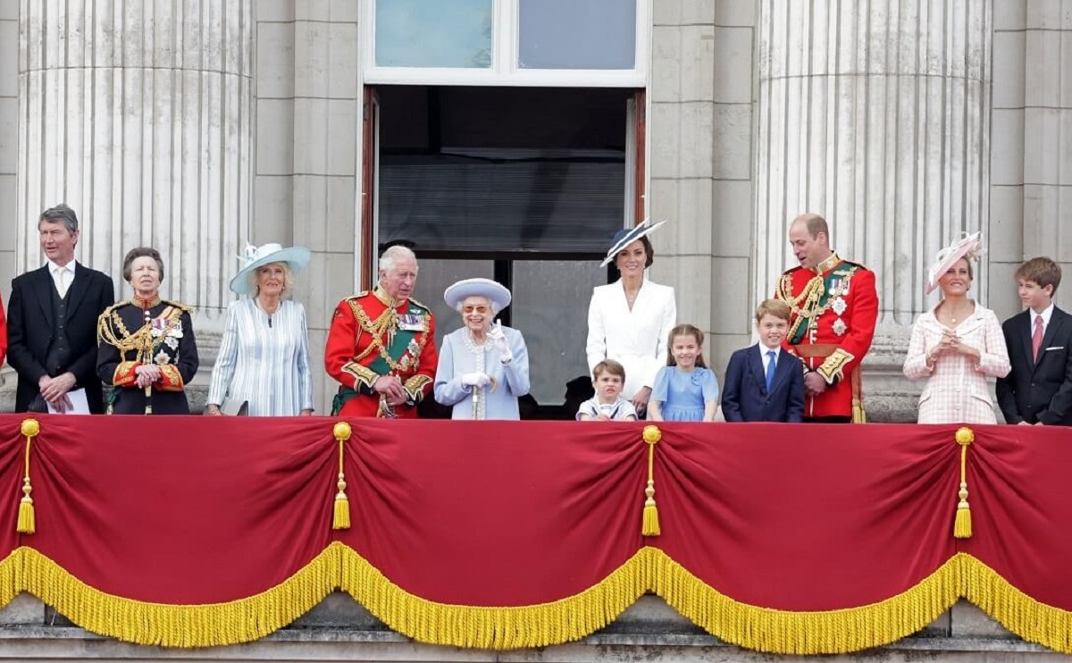 Timothy Laurence, Princess Anne, Camilla Parker Bowles, King Charles III, Queen Elizabeth II, Prince William, Kate Middleton and others standing on Buckingham Palace balcony for a flypast