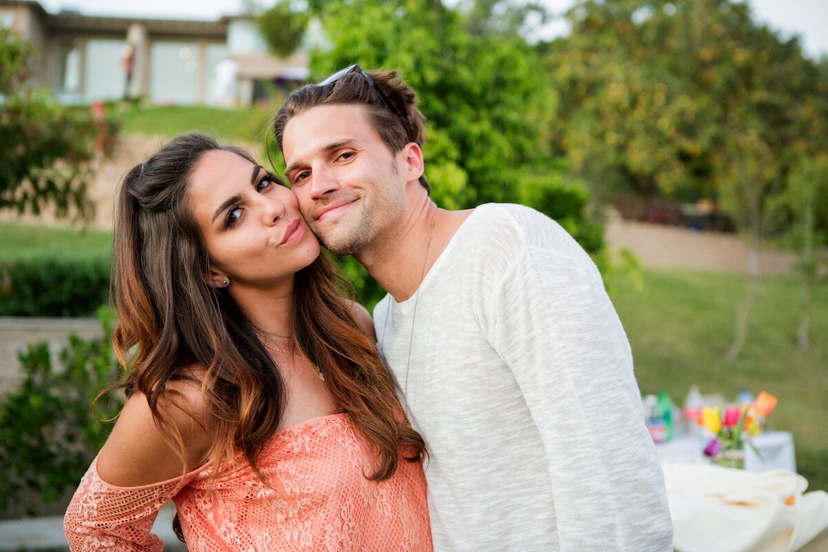 "Vanderpump Rules" stars Katie Maloney and Tom Schwartz pose outdoors with their faces pressed together.