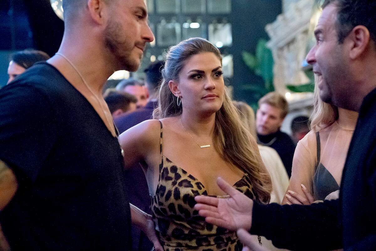 Jax Taylor, Brittany Cartwright, and Randall Emmett film a scene for Vanderpump Rules in 2019