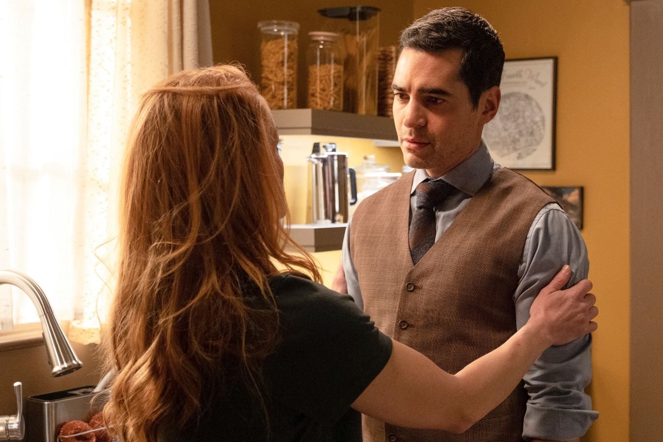 Erika Christensen and Ramón Rodríguez, in character as Angie Polaski and Will Trent in 'Will Trent,' which isn't new tonight, April 4, on ABC, share a scene. Angie wears a black shirt. Will wears a tan vest over a light gray button-up shirt and dark gray tie.