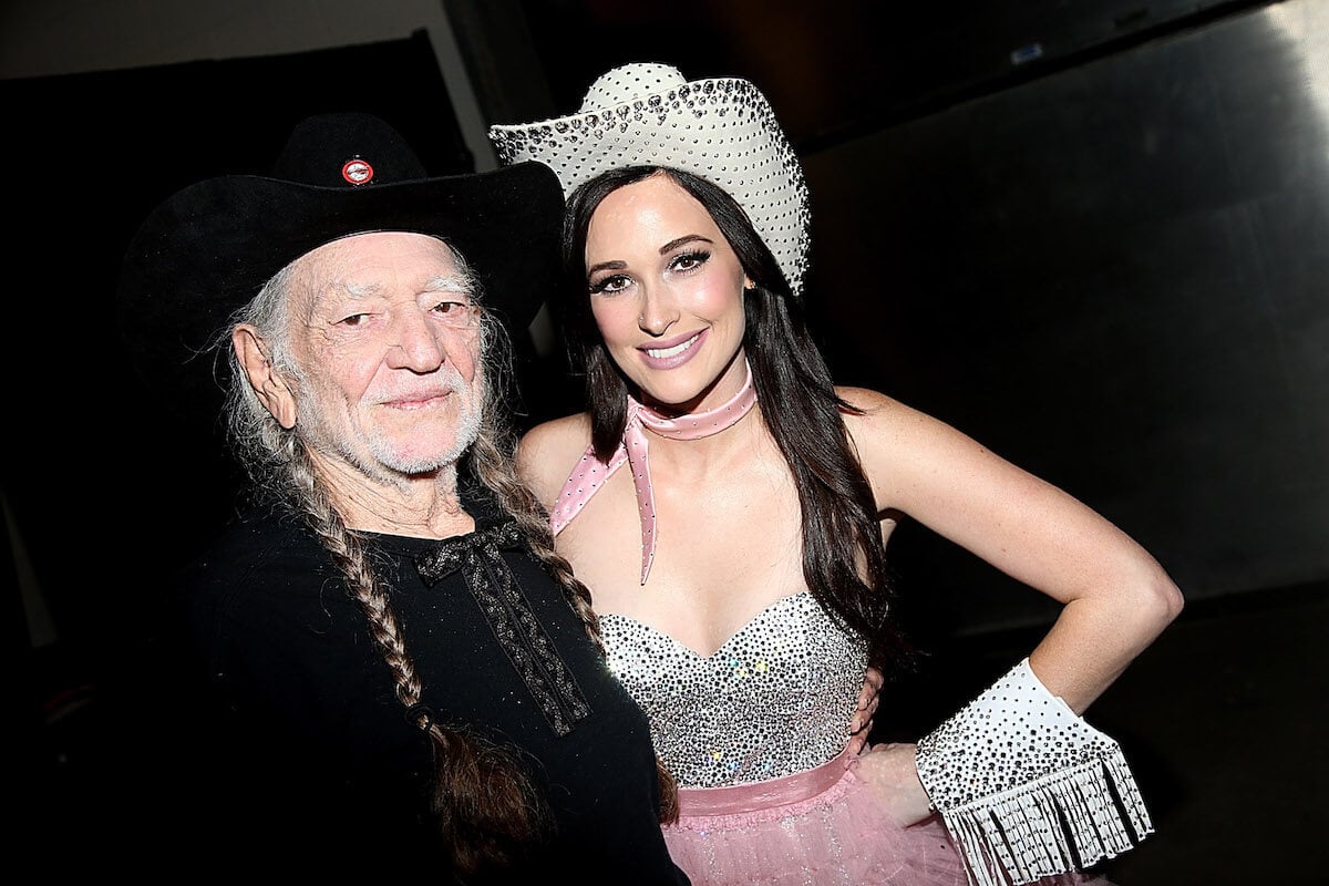 Willie Nelson and Kacey Musgraves standing together