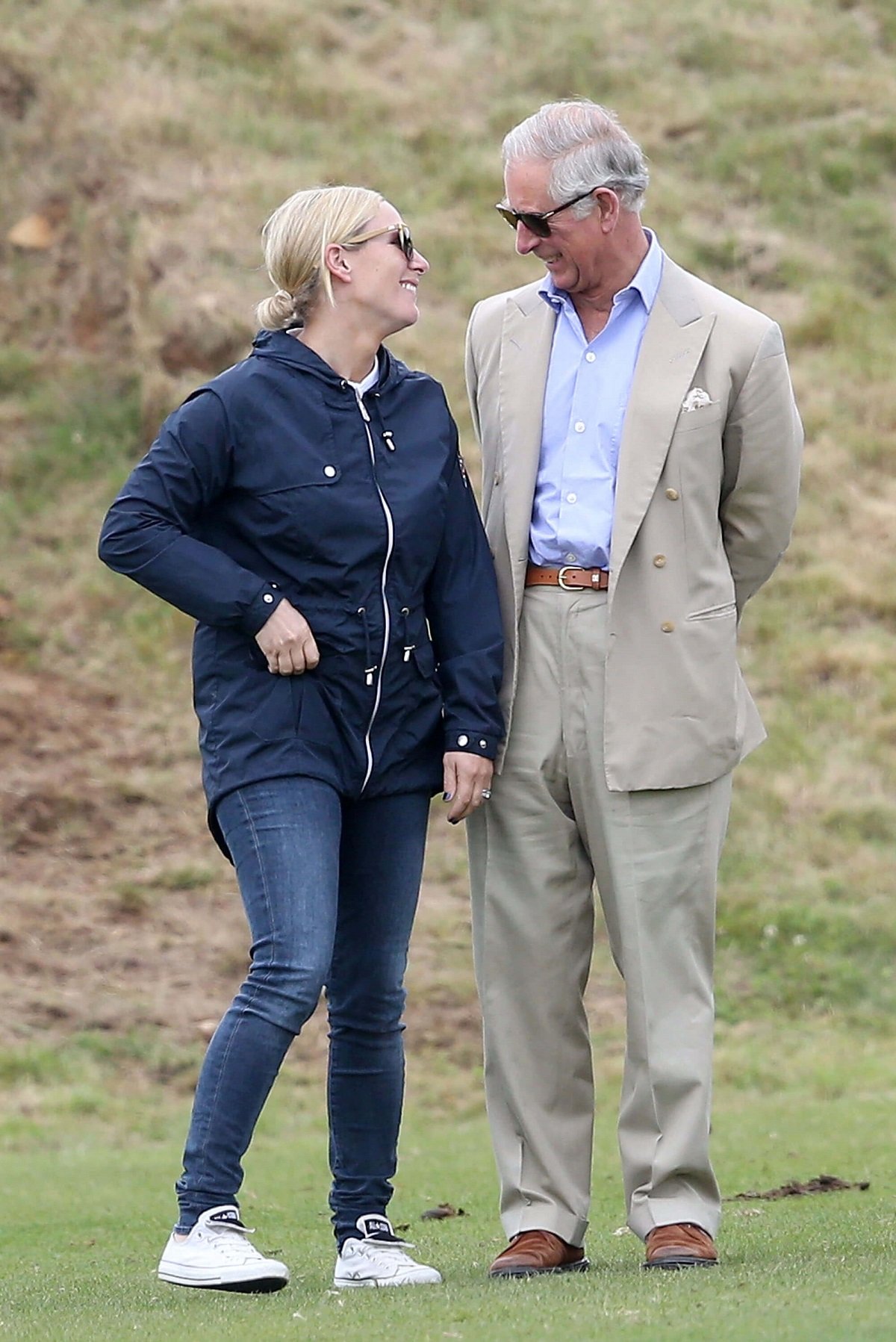 Zara Tindall and now-King Charles sharing a laugh at the Gigaset Charity Polo Match